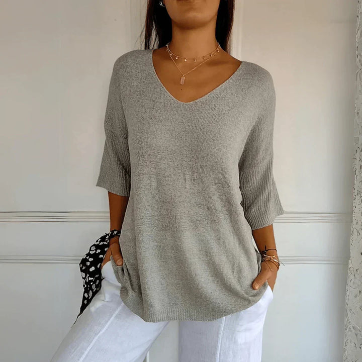 Women's V-Neckline Three-Quarter Sleeve Shirt with Dropped Shoulders and Knit Surface