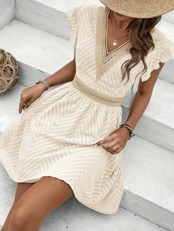 womens-mini-dress-in-woven-material-with-v-neck-trim-and-flutter-sleeves-5